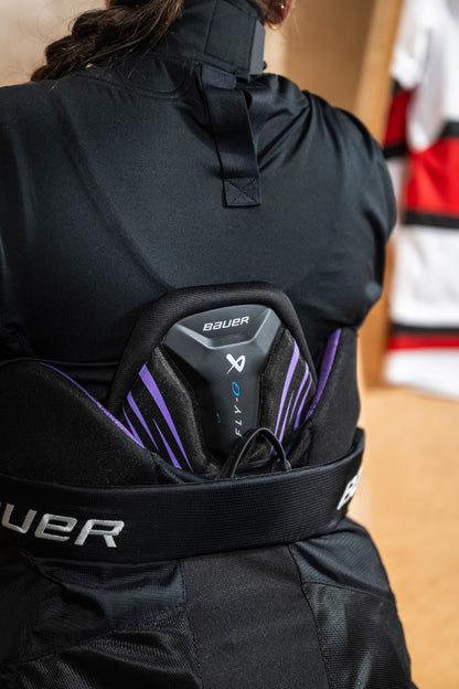 Lettermen Sports Bauer Vapor Fly-G girls hockey pants showing the protective spine guard with purple accents
